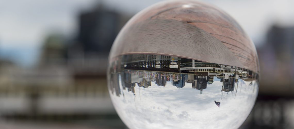 Sydney, Australia - November 6, 2015: Reflection of Darling Harbour in a crystal ball on a sunny day.